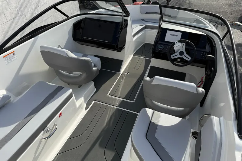 Slide: The Image of 2026 Bayliner V20 boat interior with modern seating and dashboard design. - 5