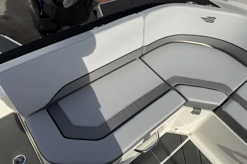 Slide: The Image of 2026 Bayliner V20 boat interior with sleek gray seating and modern design. - 8