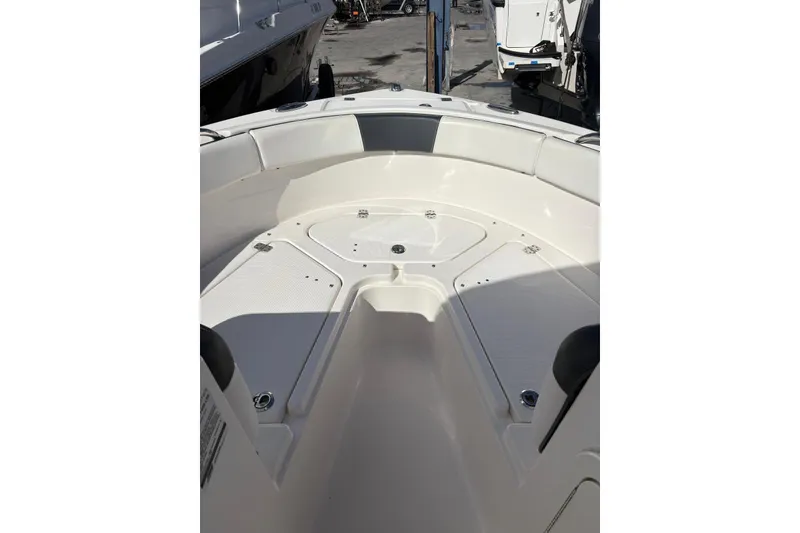 Slide: The Image of 2020 Robalo R227 Dual Console boat interior, featuring spacious seating and storage compartments. - 5