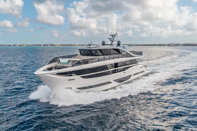 Slide: The Image of Luxurious 2023 Princess X95 yacht cruising on open sea under a partly cloudy sky. - 10