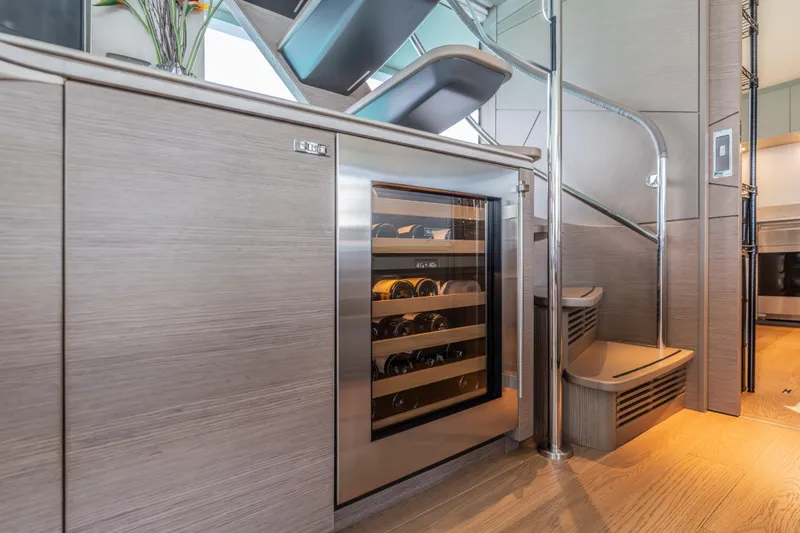 Slide: The Image of Luxurious 2023 Princess X95 yacht interior with wine cooler and modern staircase. - 109