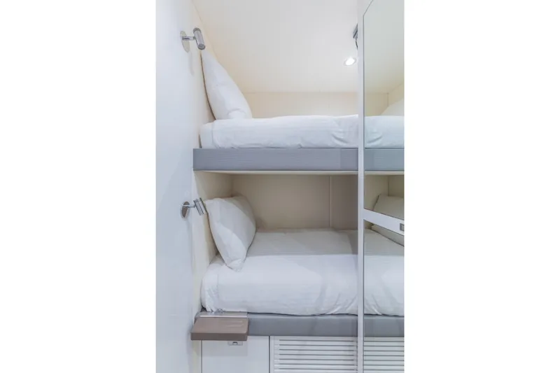 Slide: The Image of 2023 Princess X95 yacht interior with modern bunk beds and sleek design. - 118