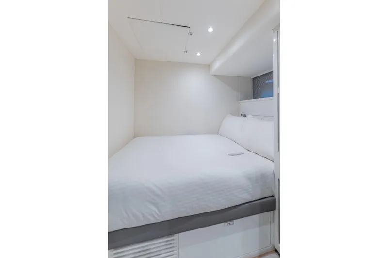 Slide: The Image of Luxurious bedroom interior of 2023 Princess X95 yacht with modern design and cozy bedding. - 119
