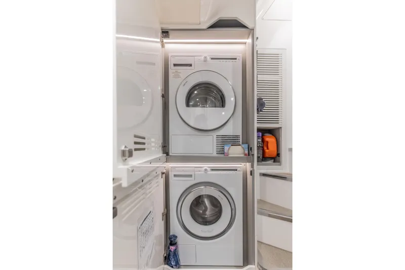 Slide: The Image of Laundry area with stacked washer and dryer on Princess X95 yacht, 2023 model. - 121