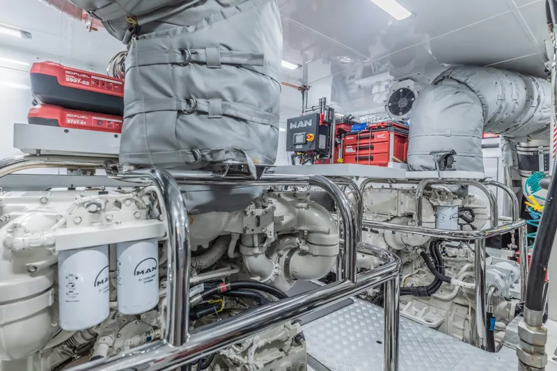 Slide: The Image of Engine room of 2023 Princess X95 yacht with MAN engines and organized tool storage. - 123