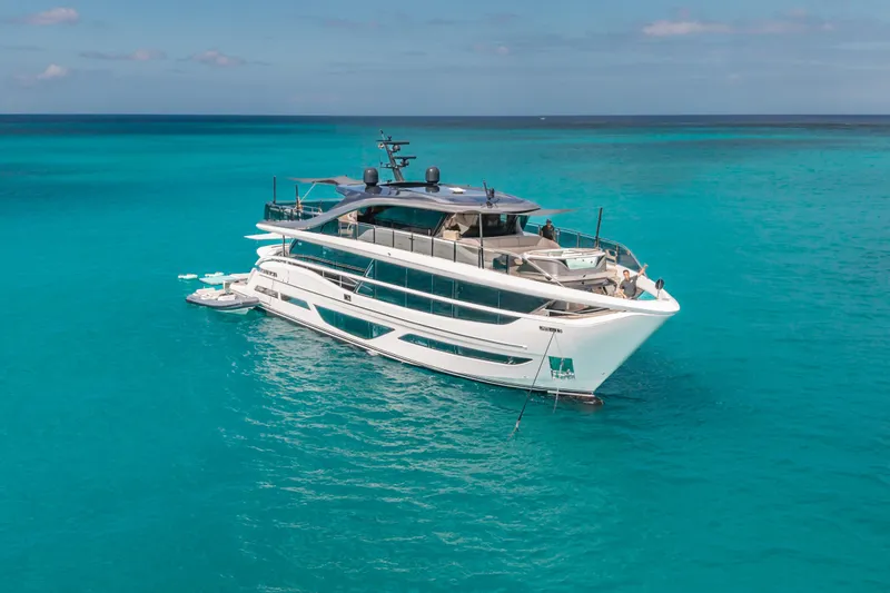 Slide: The Image of Luxury 2023 Princess X95 yacht on turquoise ocean waters. - 14