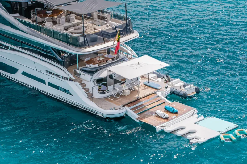 Slide: The Image of Luxurious 2023 Princess X95 yacht with spacious deck and water toys on blue ocean. - 18