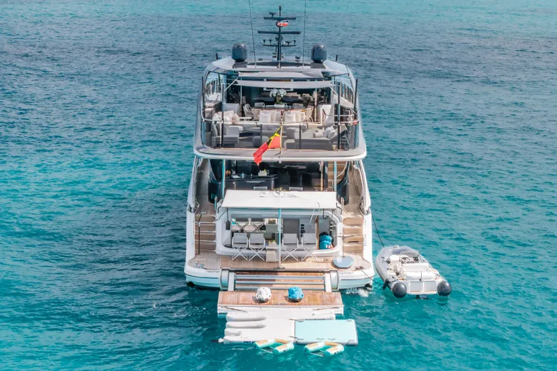 Slide: The Image of Luxurious 2023 Princess X95 yacht on clear blue ocean waters, rear view. - 19