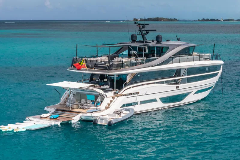 Slide: The Image of Luxurious 2023 Princess X95 yacht on turquoise ocean waters, featuring sleek design and spacious decks. - 20