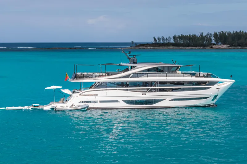 Slide: The Image of Luxury 2023 Princess X95 yacht on turquoise ocean, with clear skies and distant shoreline. - 21