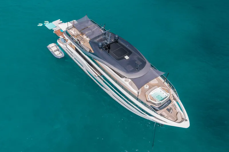 Slide: The Image of Luxurious 2023 Princess X95 yacht on turquoise waters, featuring a spacious deck and modern design. - 24