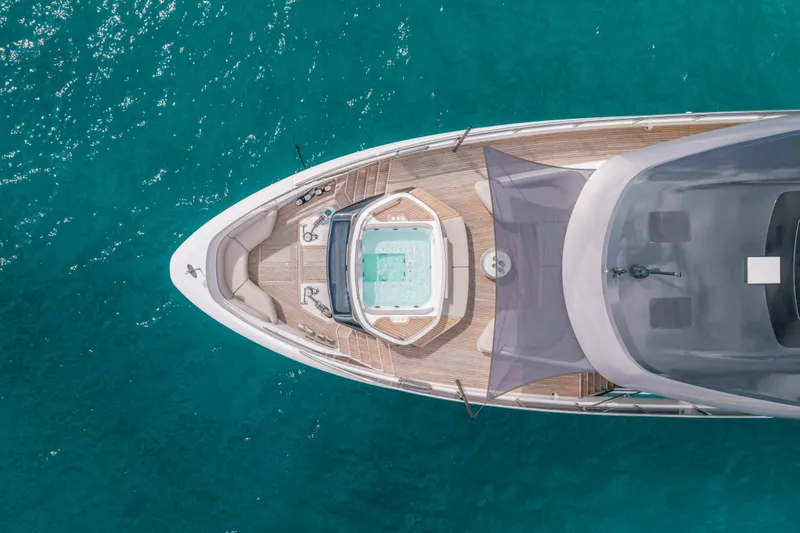 Slide: The Image of Aerial view of 2023 Princess X95 yacht with jacuzzi on turquoise water. - 26