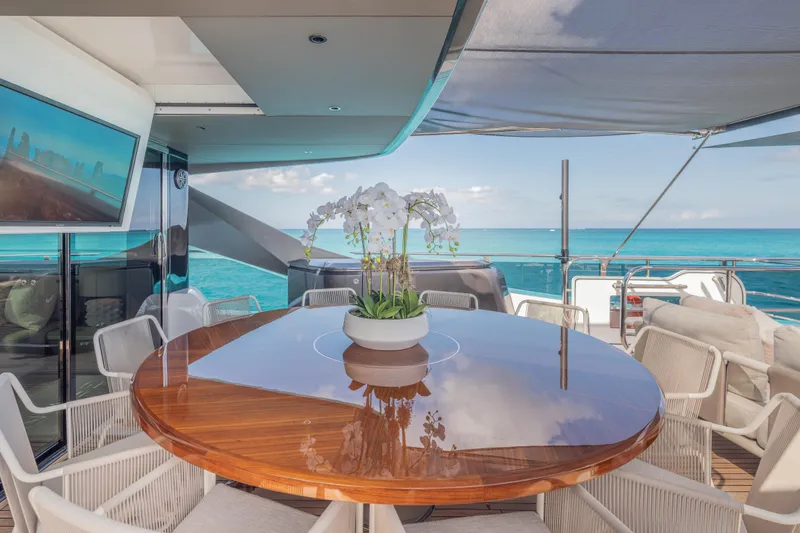 Slide: The Image of Luxurious 2023 Princess X95 yacht deck with elegant dining area and ocean view. - 38