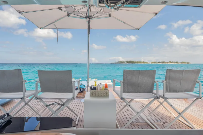 Slide: The Image of Luxury yacht Princess X95 deck with chairs, ocean view, and umbrella, 2023 model. - 46