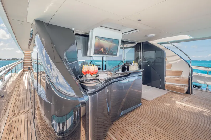 Slide: The Image of Luxurious 2023 Princess X95 yacht deck with bar, TV, and ocean view. - 49