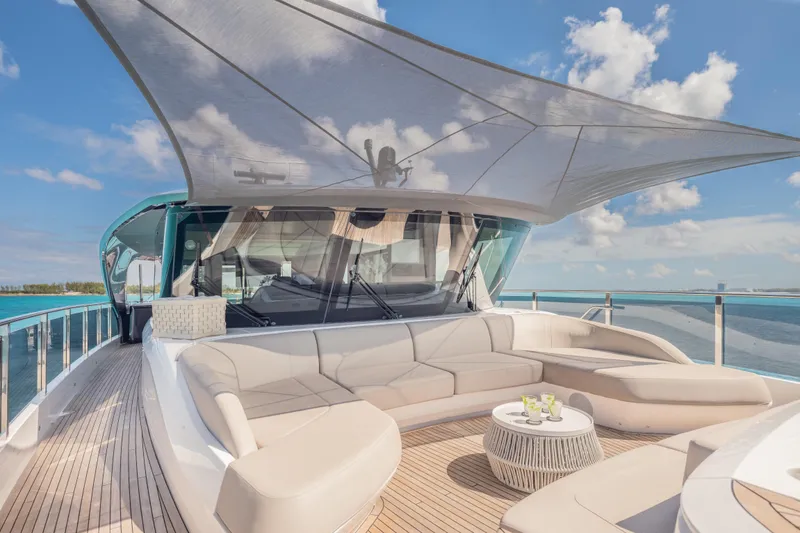 Slide: The Image of Luxurious 2023 Princess X95 yacht deck with elegant seating and ocean view. - 51