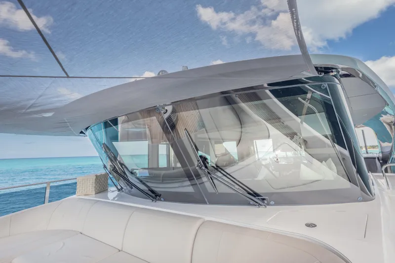 Slide: The Image of 2023 Princess X95 yacht with sleek design, ocean view, and luxurious seating. - 52