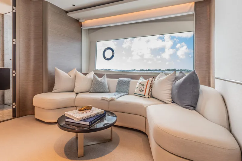 Slide: The Image of Luxurious interior of 2023 Princess X95 yacht with elegant seating and scenic window view. - 77