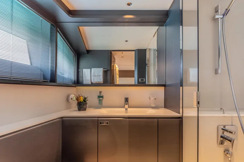 Slide: The Image of Luxurious bathroom interior of 2023 Princess X95 yacht, featuring modern fixtures and elegant design. - 86