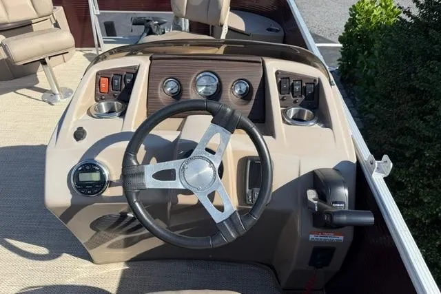 Slide: The Image of 2019 Bennington 20 SFX boat dashboard with steering wheel and control panel. - 13