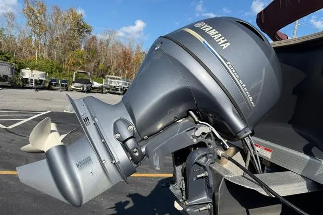 Slide: The Image of 2019 Bennington 20 SFX boat with Yamaha outboard motor in a parking lot. - 7