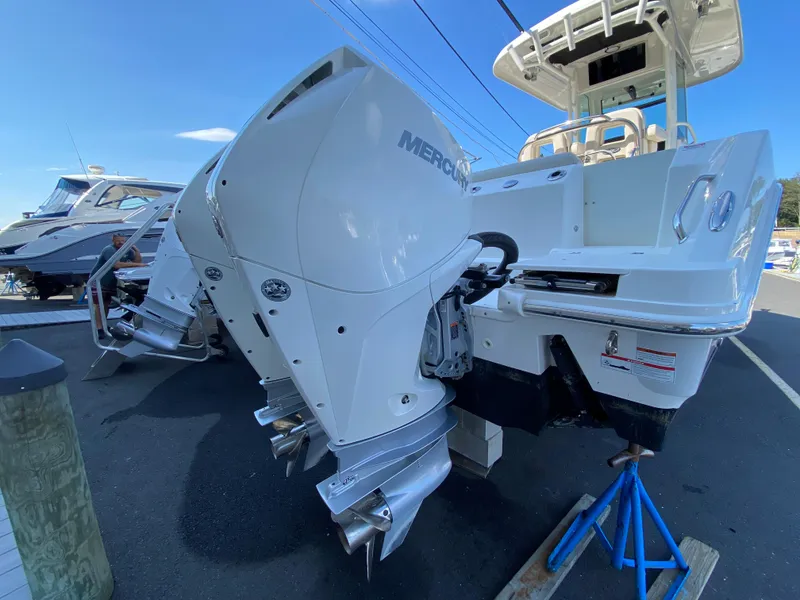 Slide: The Image of 2020 Boston Whaler 250 Outrage with Mercury engines on a trailer. - 10
