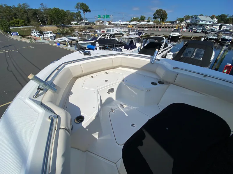 Slide: The Image of Boston Whaler 250 Outrage 2020 at dock, bow deck view. - 20