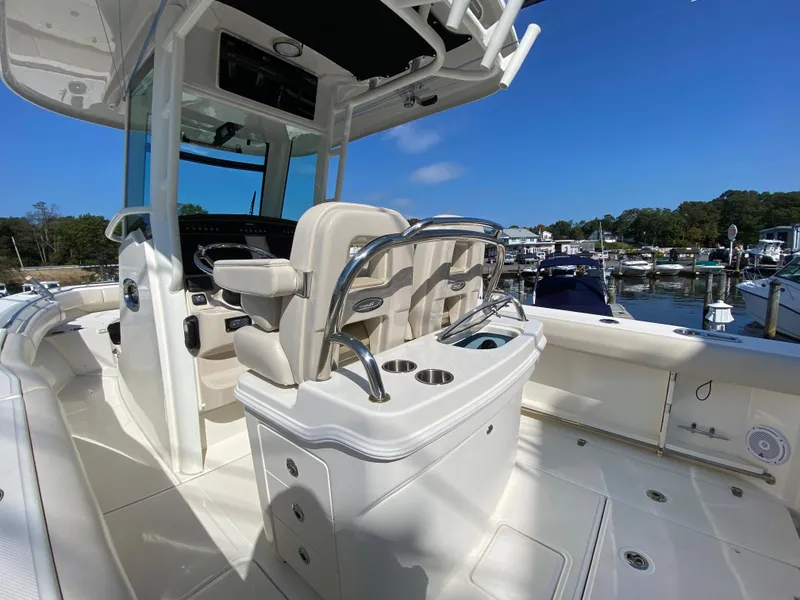 Slide: The Image of Interior view of a 2020 Boston Whaler 250 Outrage boat in a marina. - 23