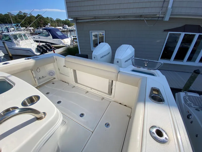 Slide: The Image of Boston Whaler 250 Outrage 2020 with twin engines at dock. - 24