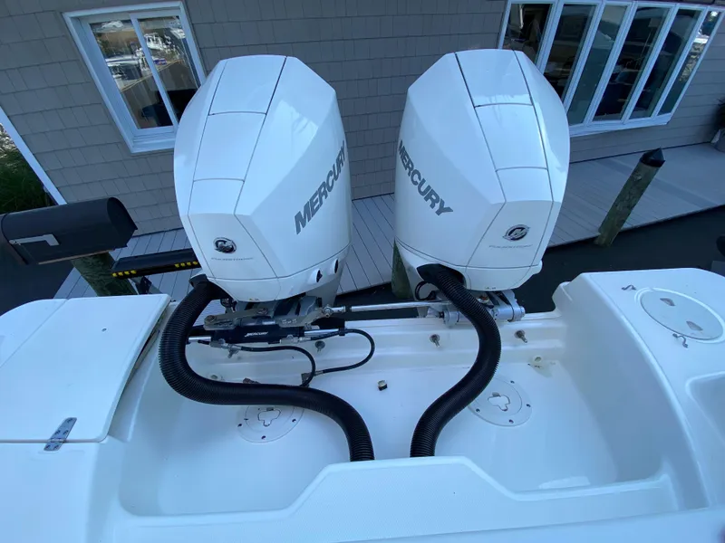 Slide: The Image of Dual Mercury engines on a 2020 Boston Whaler 250 Outrage. - 27