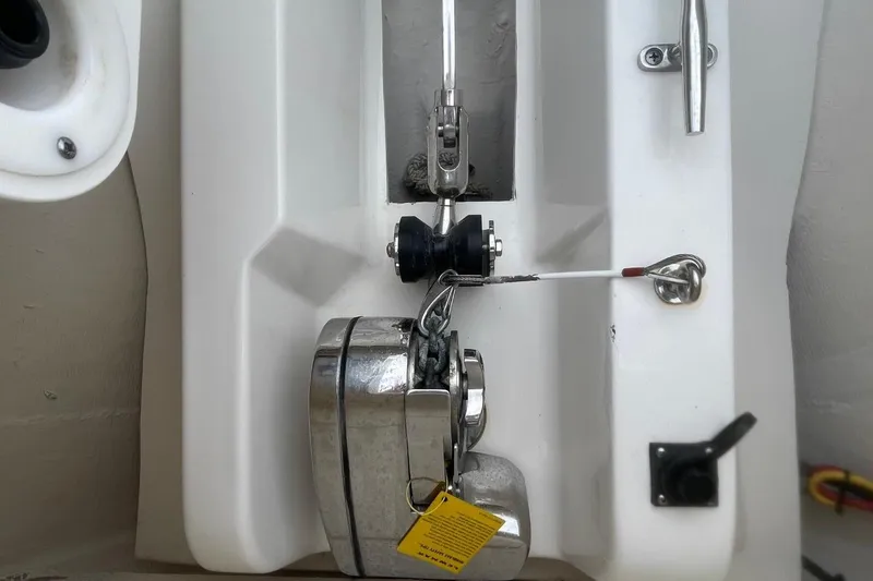 Slide: The Image of 2021 Pursuit S 328 Sport boat anchor system with chrome finish and safety tag. - 13