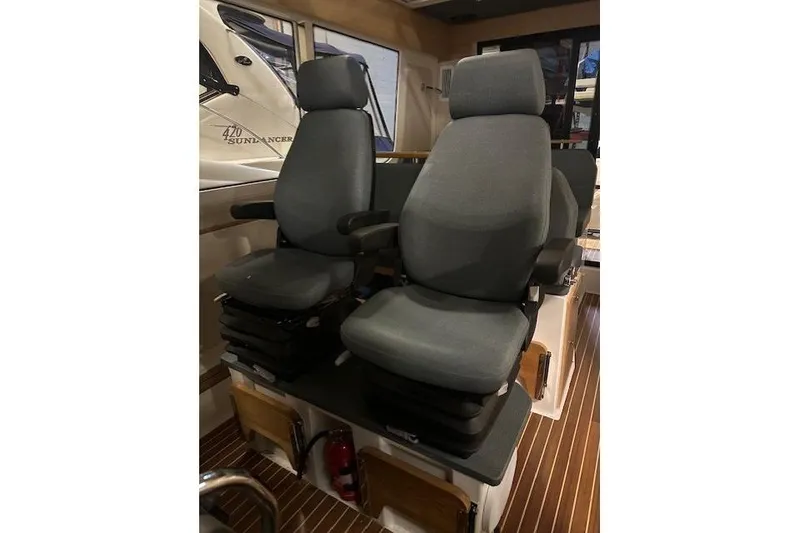 Slide: The Image of 2023 Nimbus C11 boat interior with two ergonomic captain seats. - 14
