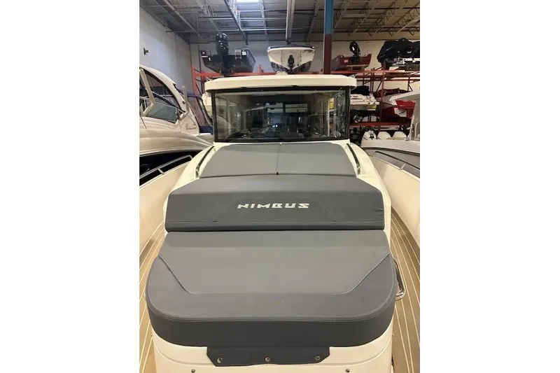 Slide: The Image of 2023 Nimbus C11 boat in showroom, featuring sleek design and modern aesthetics. - 23