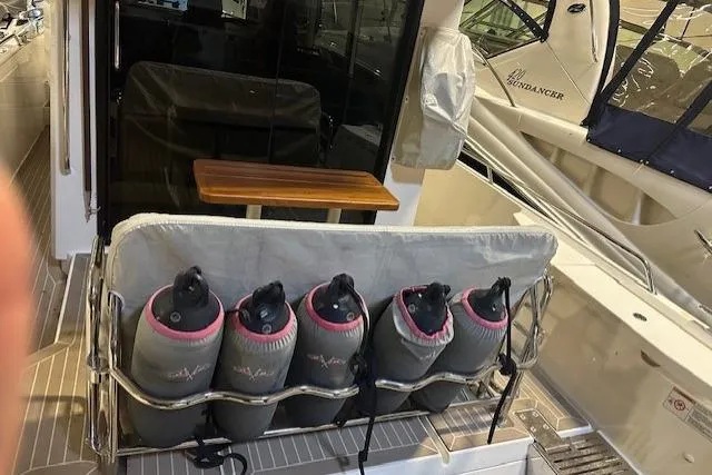 Slide: The Image of 2023 Nimbus C11 boat with fenders stored on the deck, showcasing sleek design and functionality. - 28