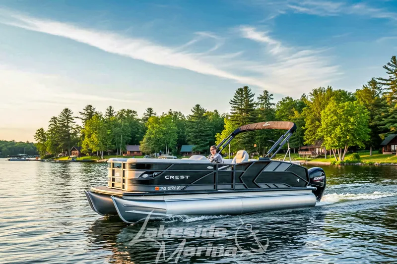 The Image of 2023 Crest Caribbean LX 230 SLC CP3 pontoon boat cruising on a scenic lake. - 0