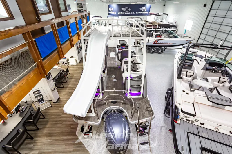 Slide: The Image of 2023 Godfrey AquaPatio 255 SDC pontoon boat with slide in showroom. - 11