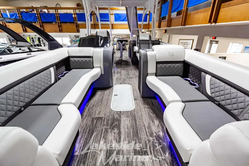 Slide: The Image of 2023 Godfrey AquaPatio 255 SDC luxury pontoon boat interior with plush seating and modern design. - 16