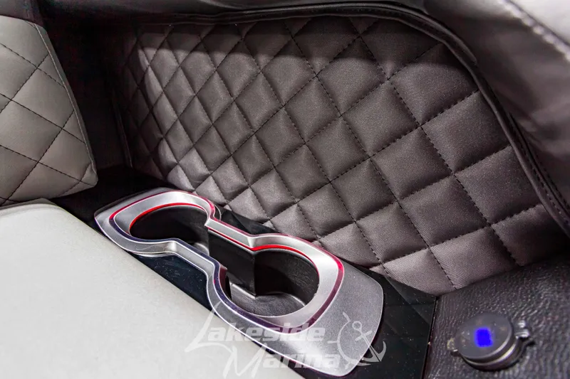 Slide: The Image of 2023 Godfrey AquaPatio 255 SDC interior cup holders with quilted upholstery. - 21