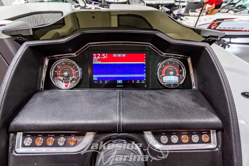 Slide: The Image of Dashboard of 2023 Godfrey AquaPatio 255 SDC boat with digital display and controls. - 28