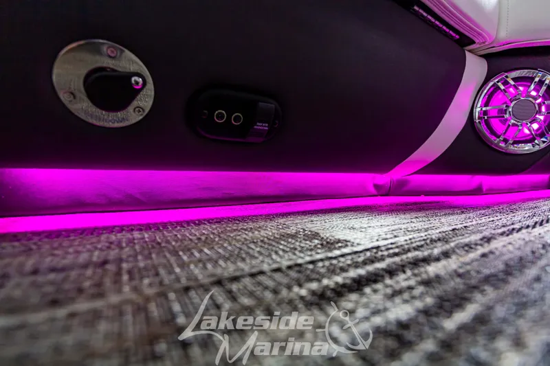 Slide: The Image of 2023 Godfrey AquaPatio 255 SDC interior with purple LED lighting and Lakeside Marina logo. - 34