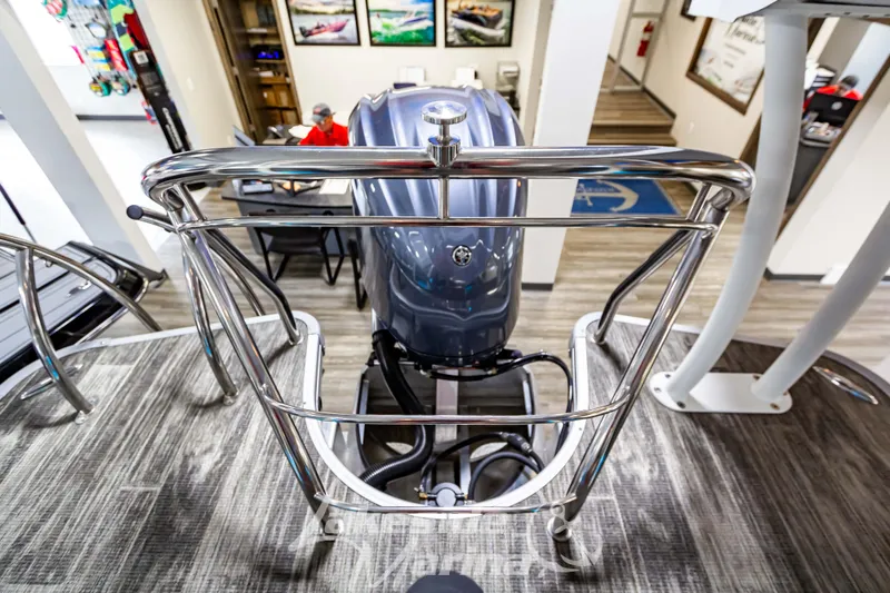 Slide: The Image of 2023 Godfrey AquaPatio 255 SDC boat engine and control area in showroom. - 41