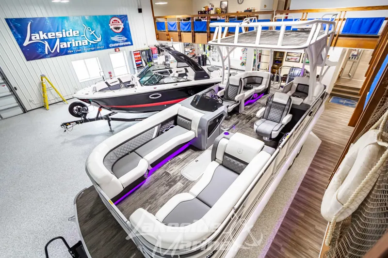 Slide: The Image of 2023 Godfrey AquaPatio 255 SDC pontoon boat displayed at Lakeside Marina showroom. - 9