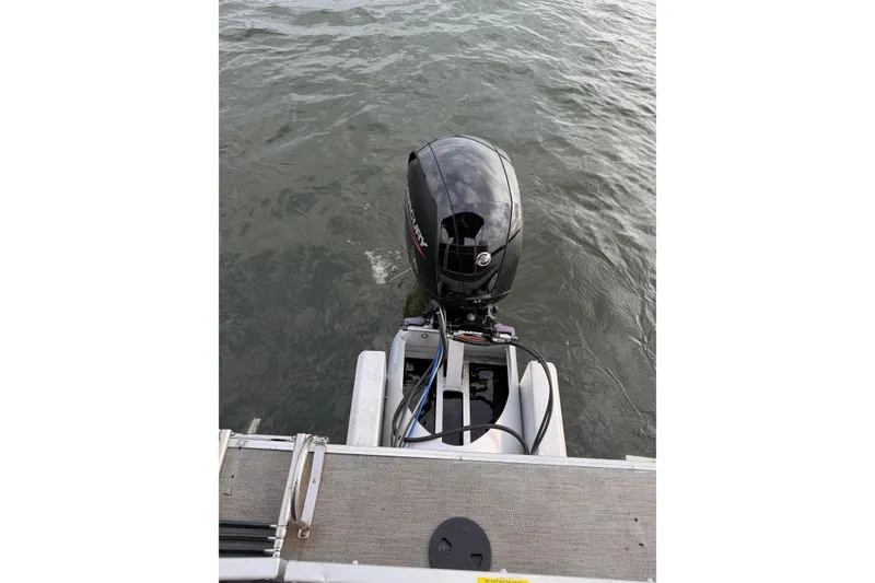 Slide: The Image of 2023 Godfrey Sweetwater 2286 C boat with Mercury outboard motor on water. - 15