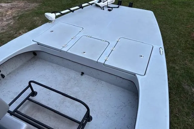 Slide: The Image of 2025 Freedom Boats 23' Warrior deck with storage compartments and railing. - 11