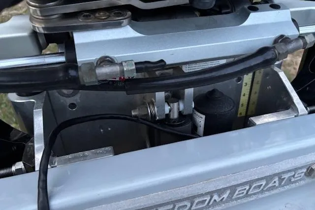 Slide: The Image of Close-up of 2025 Freedom Boats 23' Warrior engine components and hydraulic system. - 15