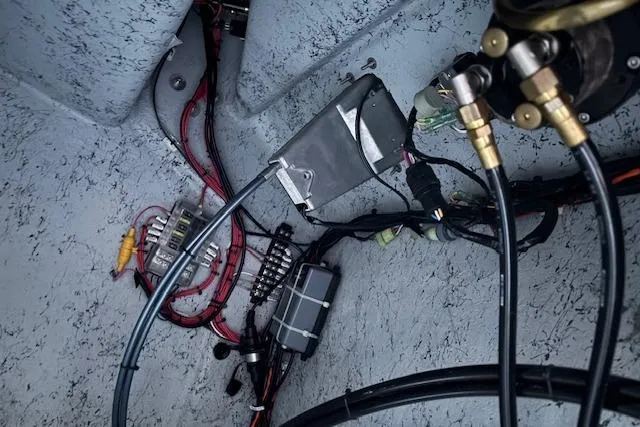 Slide: The Image of Electrical wiring and components inside a 2025 Freedom Boats 23' Warrior. - 18