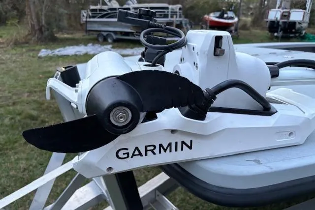 Slide: The Image of Garmin boat motor on 2025 Freedom Boats 23' Warrior, outdoor setting. - 5