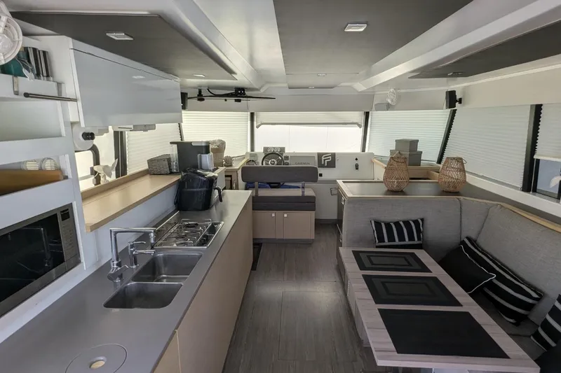 Slide: The Image of Modern interior of 2020 Fountaine Pajot MY 37 yacht with kitchen and seating area. - 12