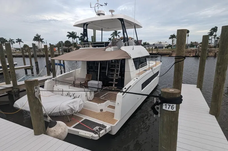 Slide: The Image of 2020 Fountaine Pajot MY 37 yacht docked at marina with palm trees. - 3