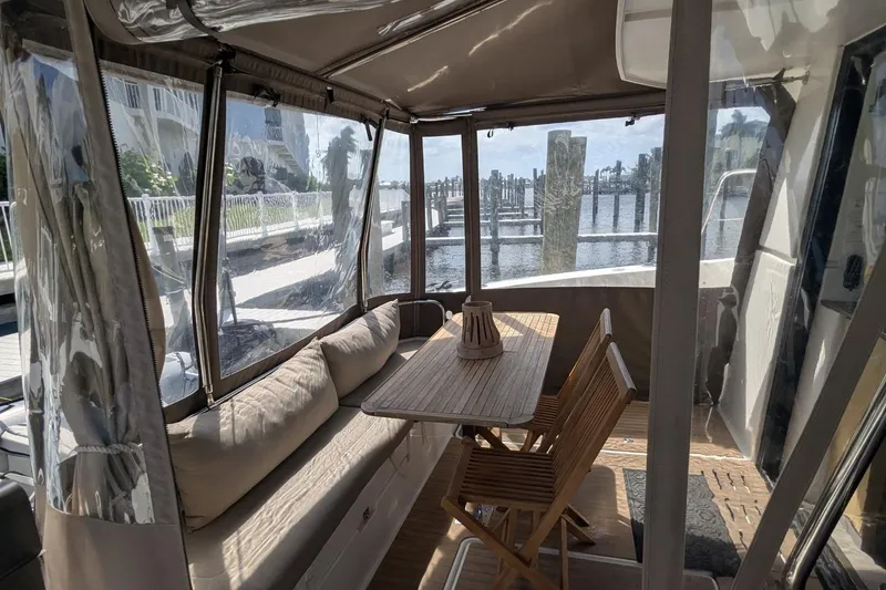 Slide: The Image of 2020 Fountaine Pajot MY 37 yacht interior with cozy seating and wooden table. - 23